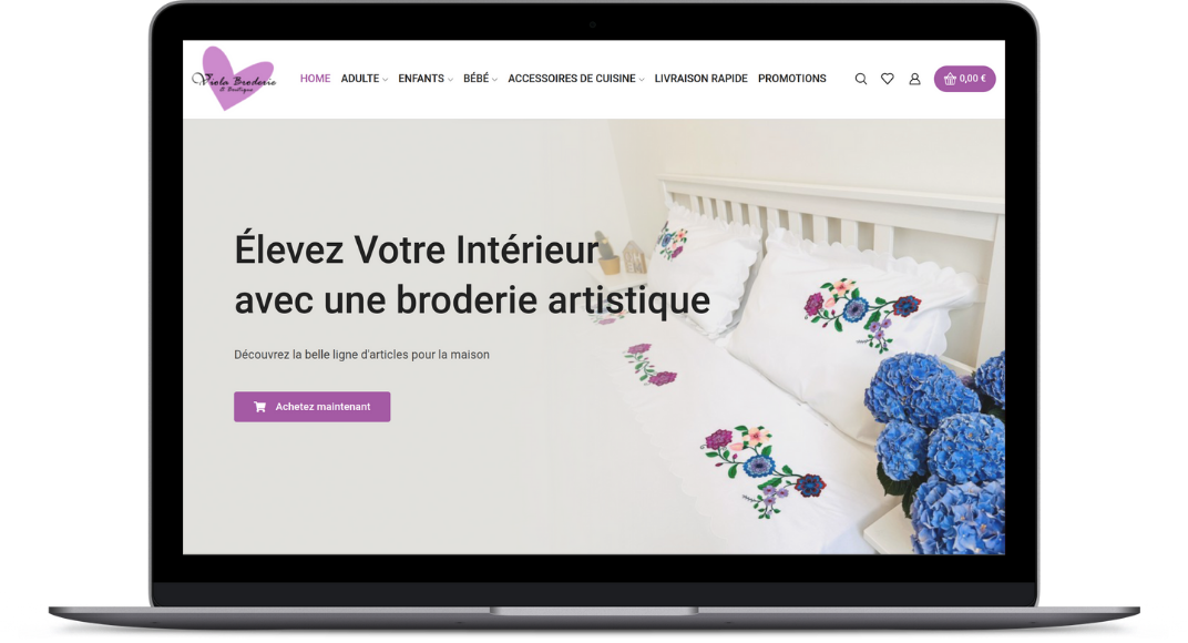 Un laptop che mostra la homepage di Broderie Viola